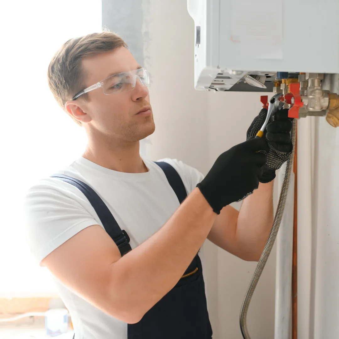 plumbing professional working on a water softener