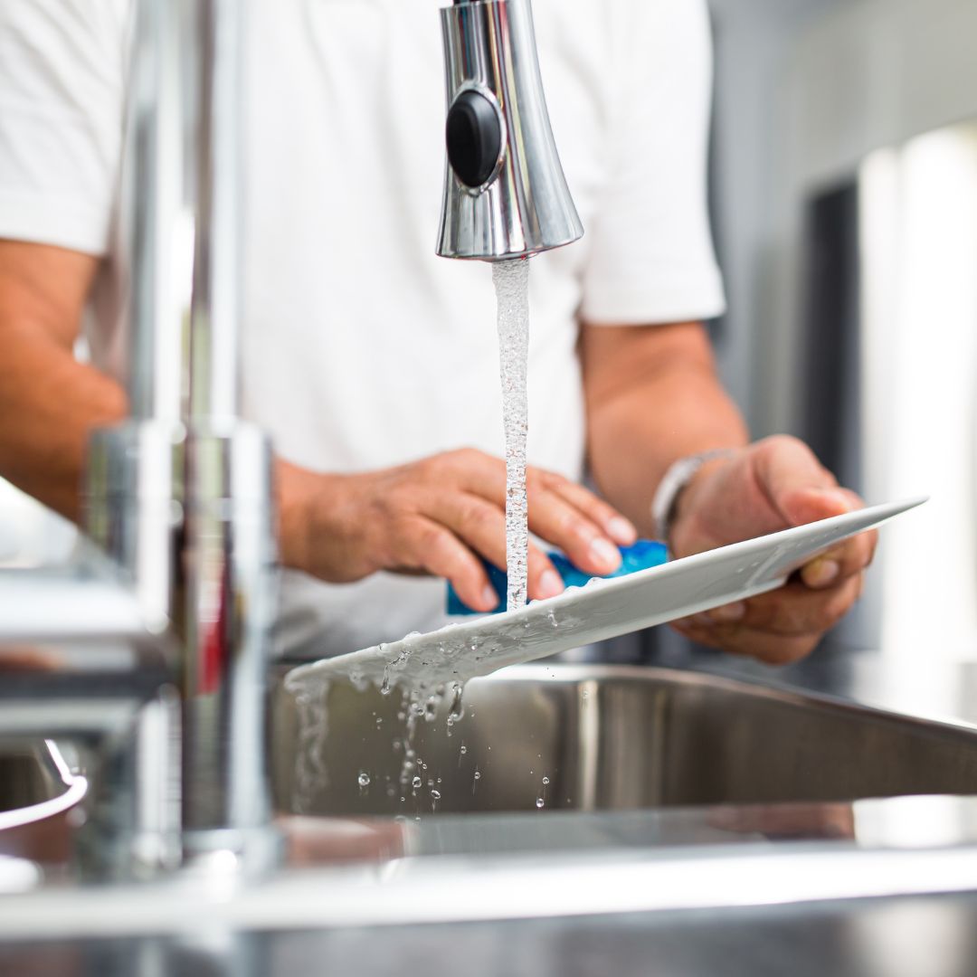 person washing dishes