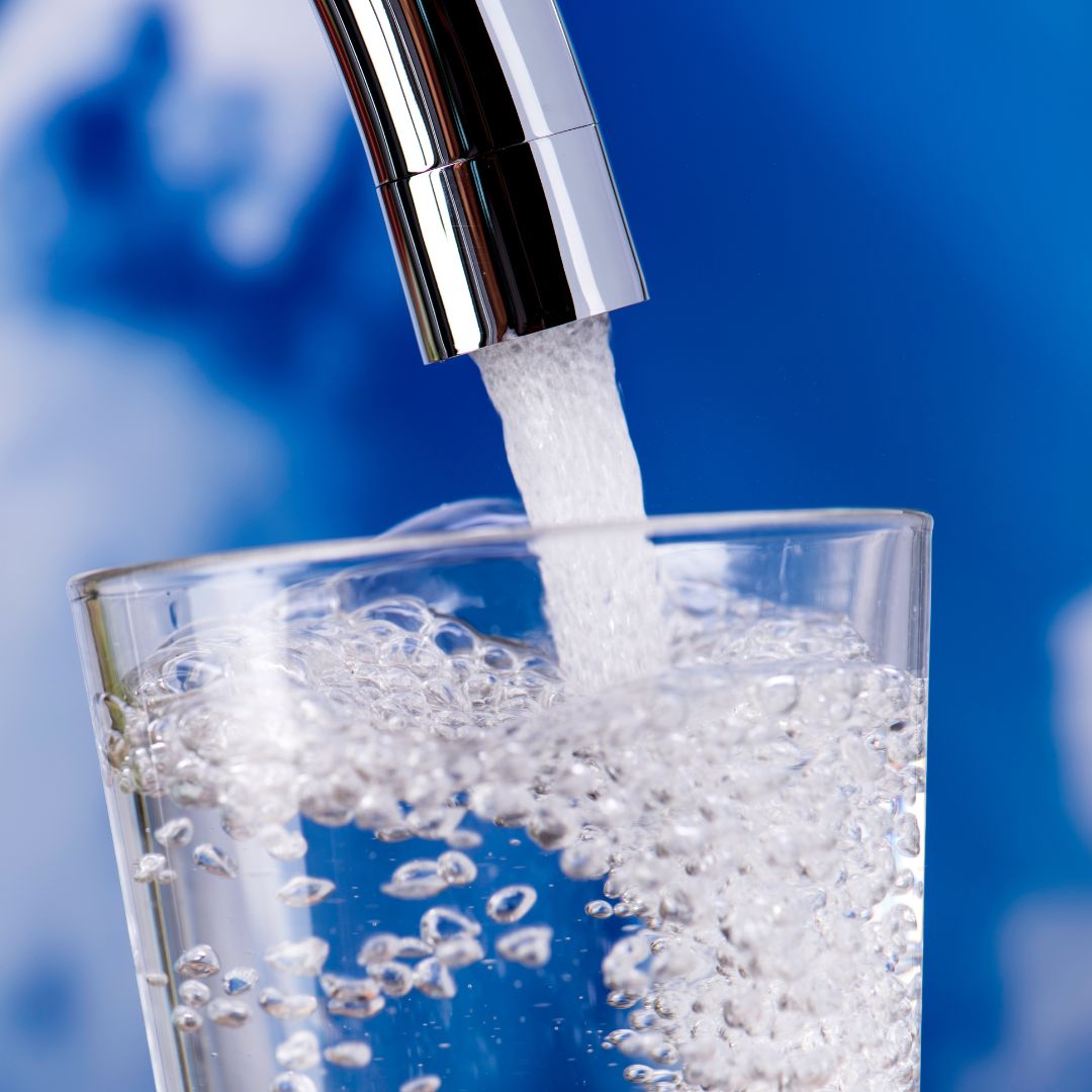 pour clean water from faucet into glass pour clean water from faucet into glass